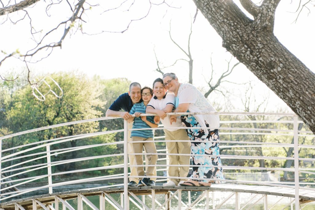 family smiling on bridge at medicine park oklahoma