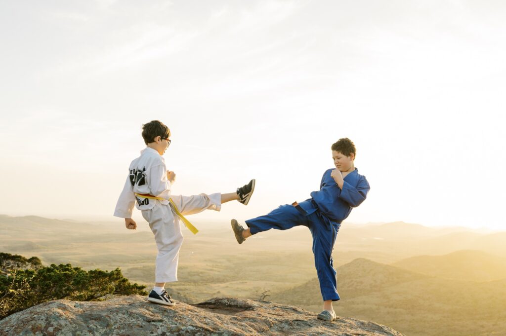 brothers doing taekwondo on top of mount scott oklahoma